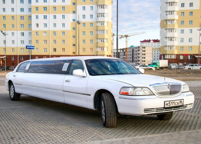 Novyy Urengoy, Russia - May 23, 2016: White stretch car Lincoln Town Car in the city street.